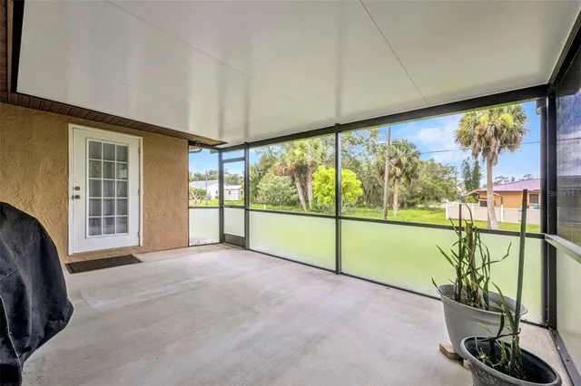 a view of an empty room with glass door
