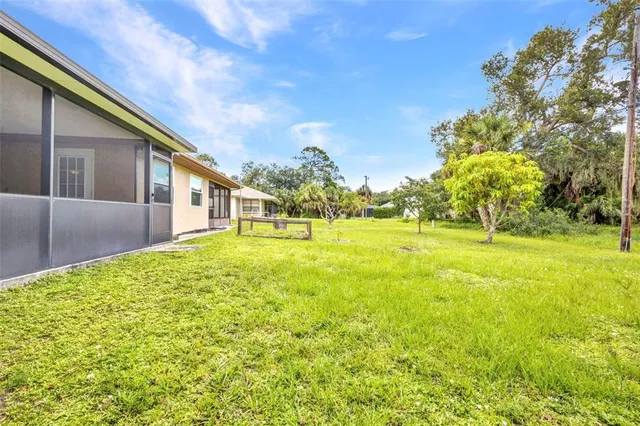 a view of backyard with green space