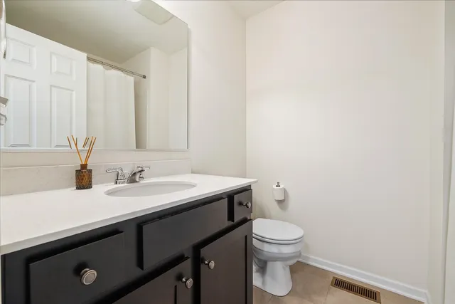 a view of a patio with a table chairs and a swimming pool