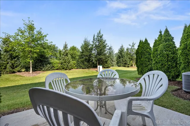 a front view of a house with a yard and porch