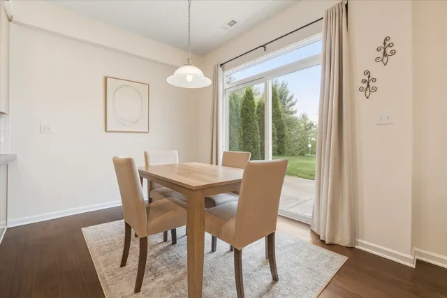 a kitchen with stainless steel appliances granite countertop a sink refrigerator and cabinets