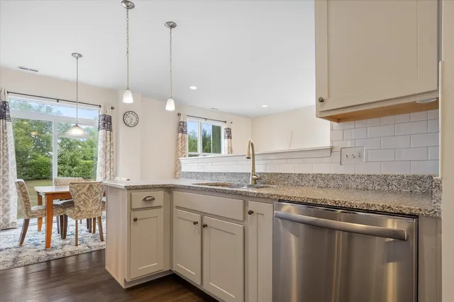 a bathroom with a sink a mirror and shower