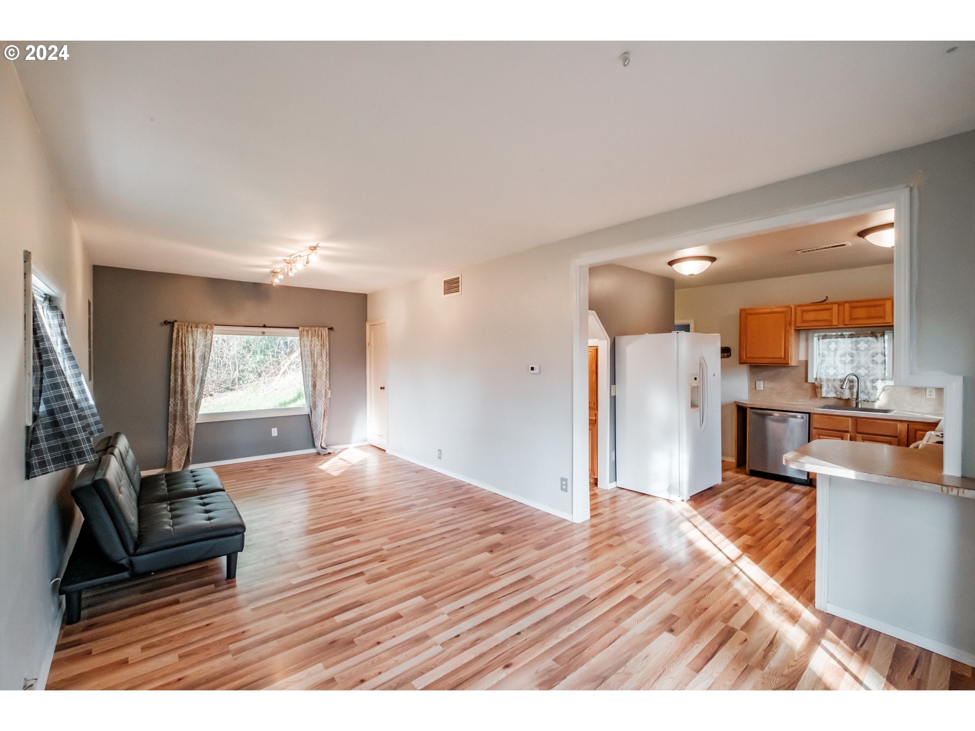 3725 Cordon Road Northeast Salem, OR 97305 - Photo 8 of 15 a living room with furniture and a wooden floor