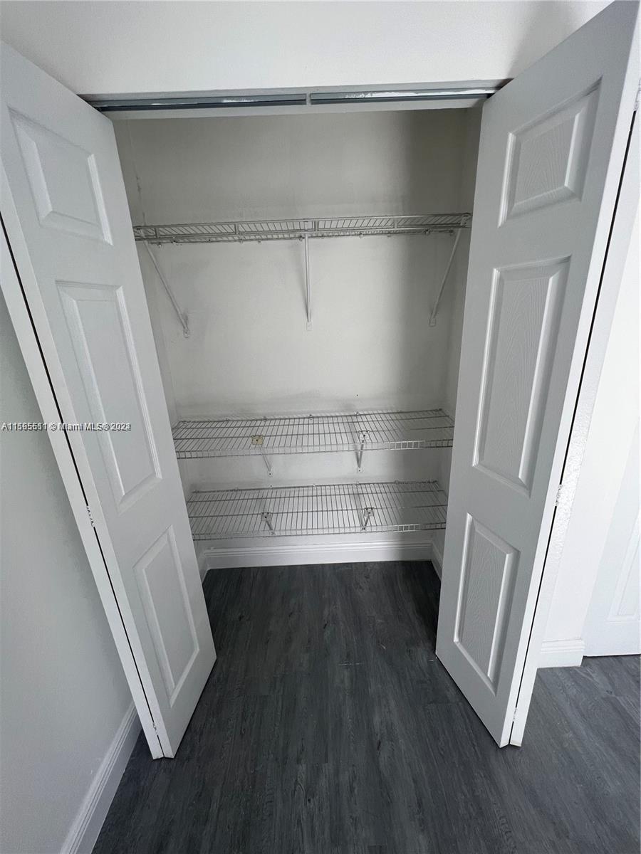 2050 Southwest 122nd Avenue, Unit 22 Miami, FL 33175 - Photo 21 of 24 a view of walk in closet with empty racks