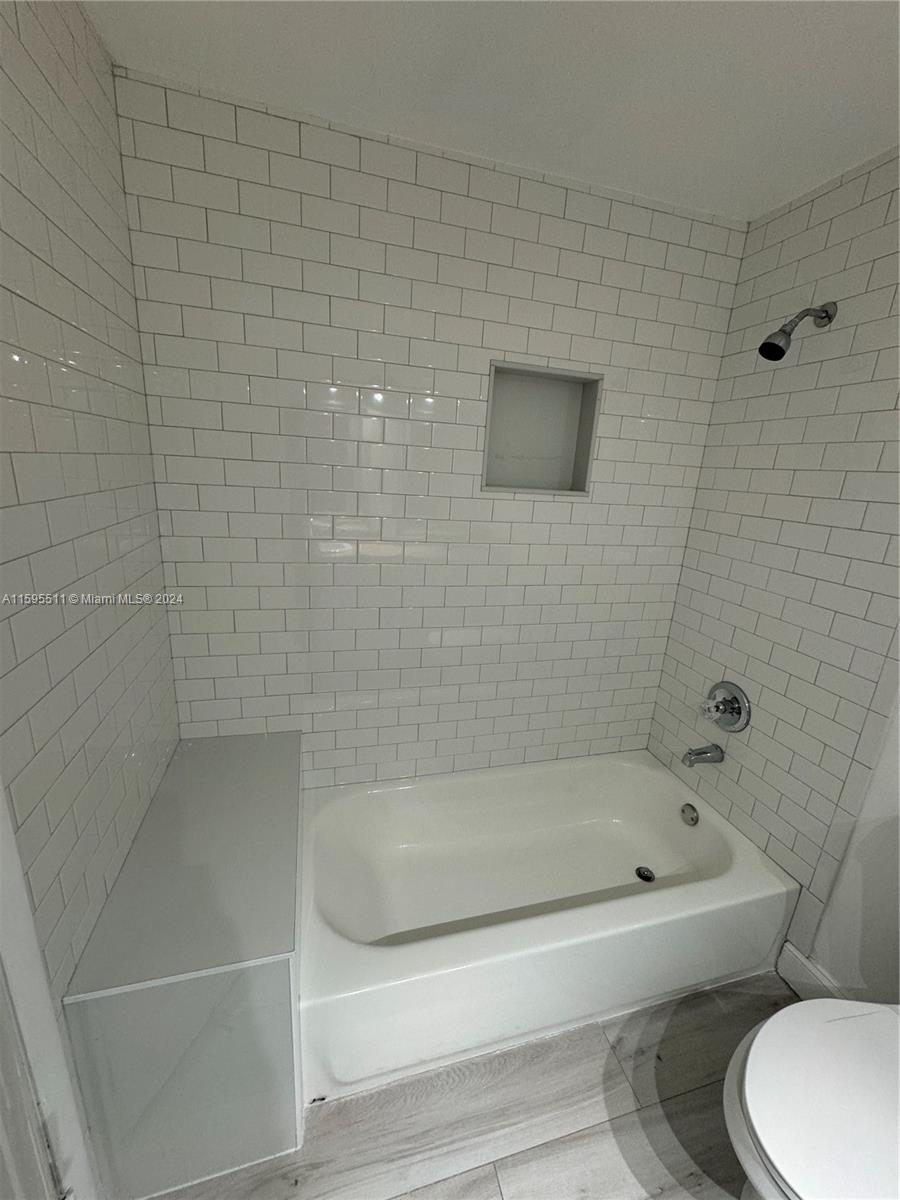 2050 Southwest 122nd Avenue, Unit 22 Miami, FL 33175 - Photo 22 of 24 a bathroom with a bathtub and toilet
