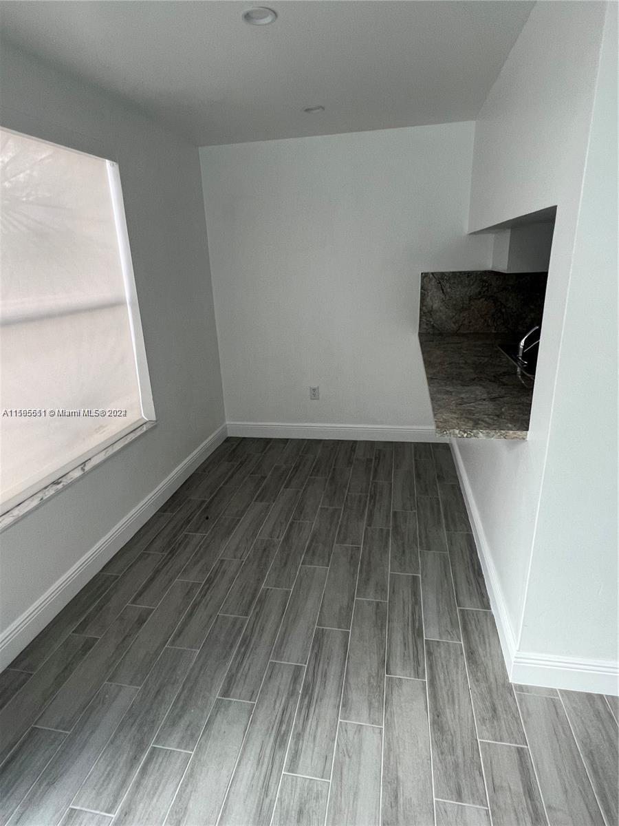 2050 Southwest 122nd Avenue, Unit 22 Miami, FL 33175 - Photo 7 of 24 a view of wooden floor in a room