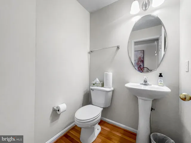 a large bedroom with a bed and a chandelier