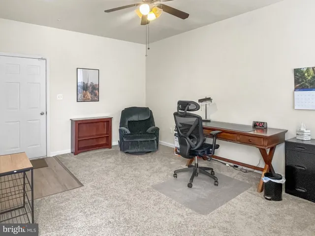 a view of workspace with a window and gym equipment
