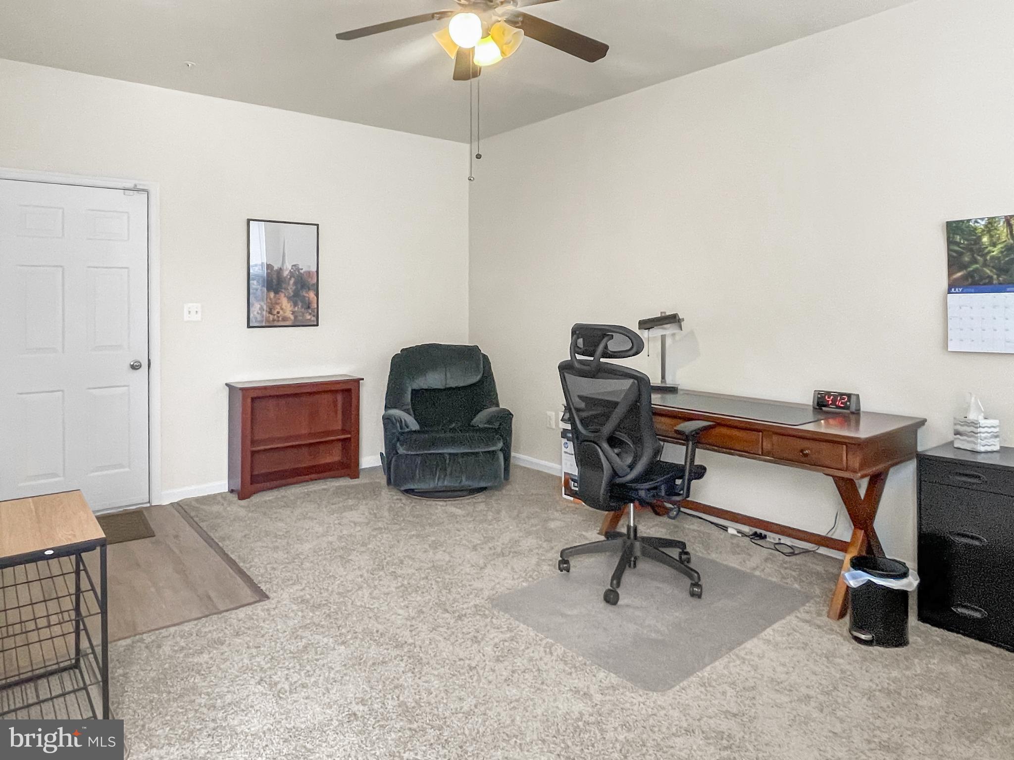 12 South Exeter Street, Unit 140 Baltimore, MD 21202 - Photo 2 of 30 a view of workspace with a window and gym equipment