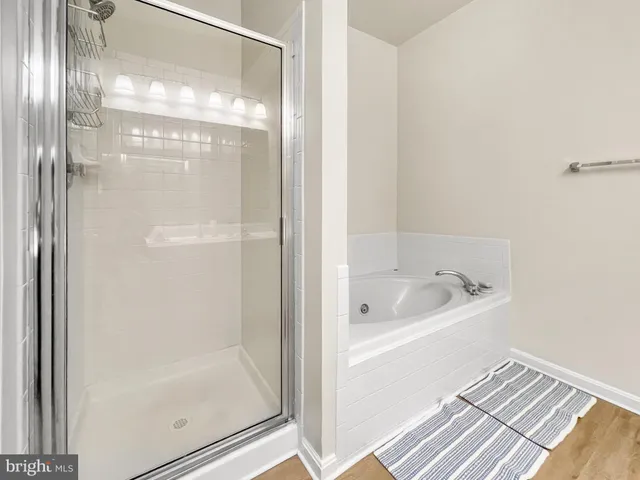 a view of a walk in closet with living room