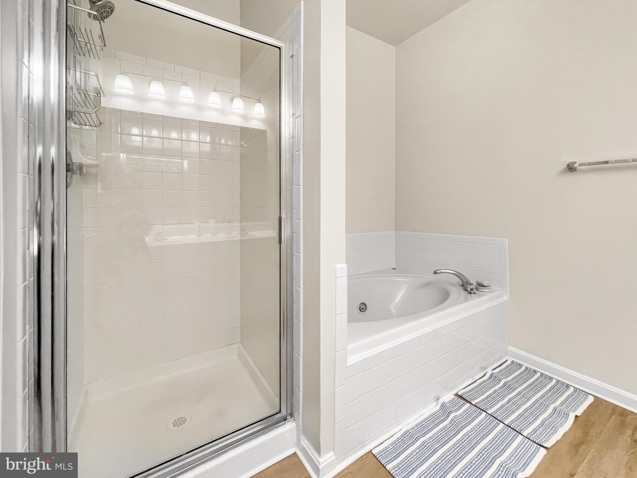 12 South Exeter Street, Unit 140 Baltimore, MD 21202 - Photo 22 of 30 a bathroom with a bathtub and a shower