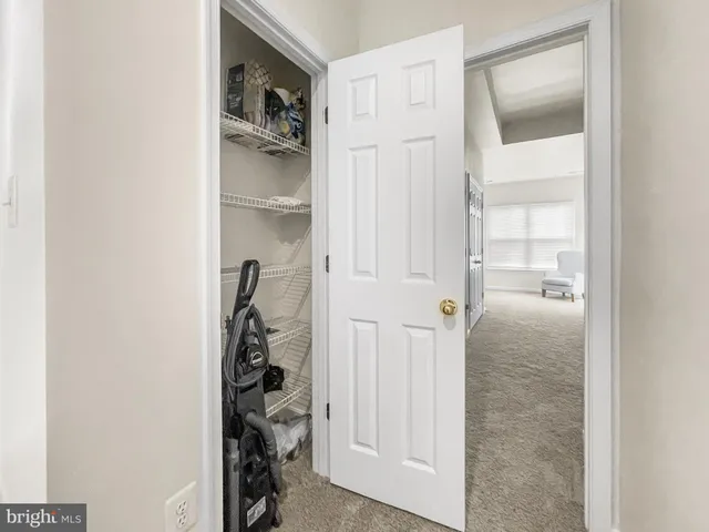 a bedroom with furniture and a closet