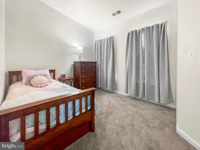 a bedroom with a bed and a cabinets