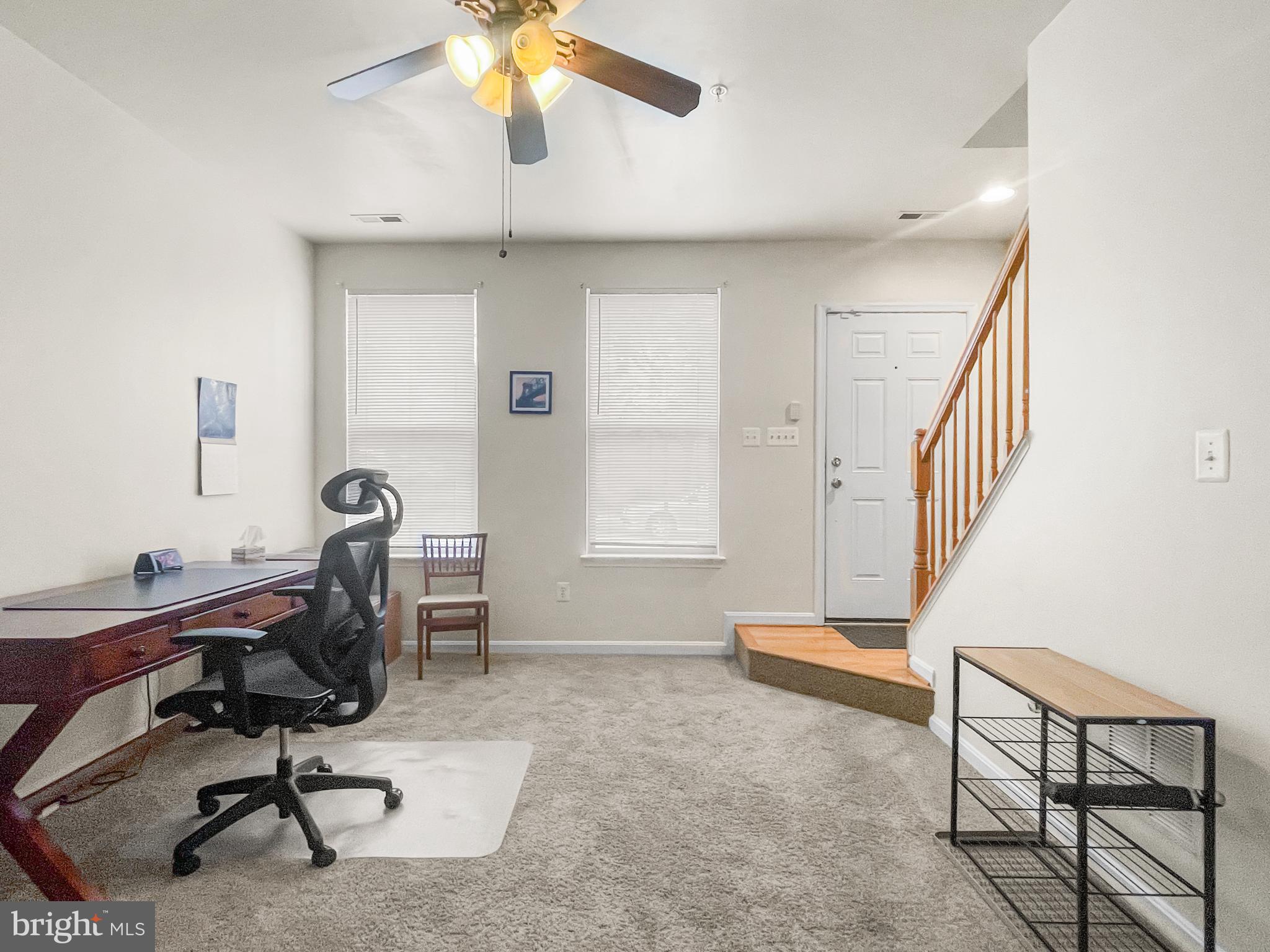12 South Exeter Street, Unit 140 Baltimore, MD 21202 - Photo 3 of 30 a view of a workspace with furniture and a window