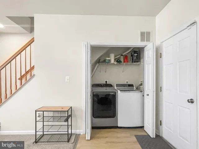 a kitchen with a stove and a refrigerator