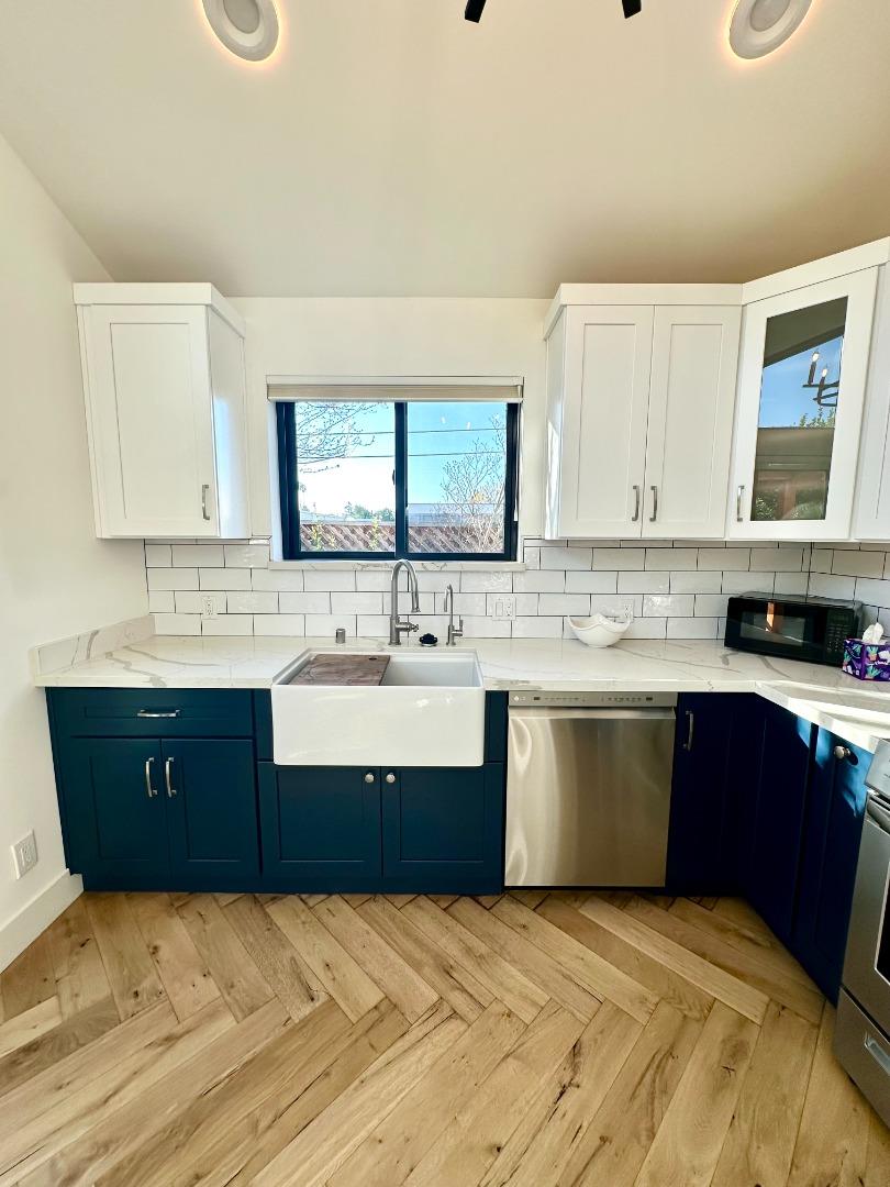1092 Washington Street Mountain View, CA 94043 - Photo 15 of 32 a kitchen with stainless steel appliances granite countertop a sink and cabinets