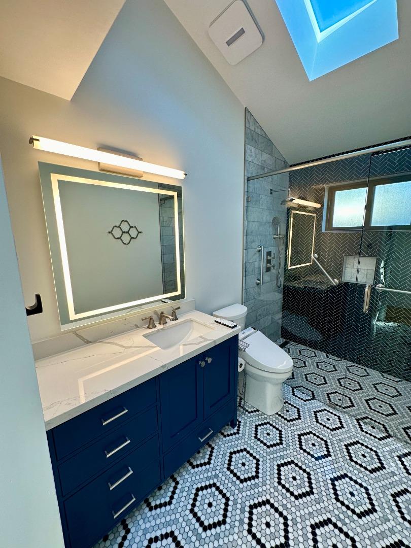 1092 Washington Street Mountain View, CA 94043 - Photo 23 of 32 a bathroom with a sink mirror vanity and toilet