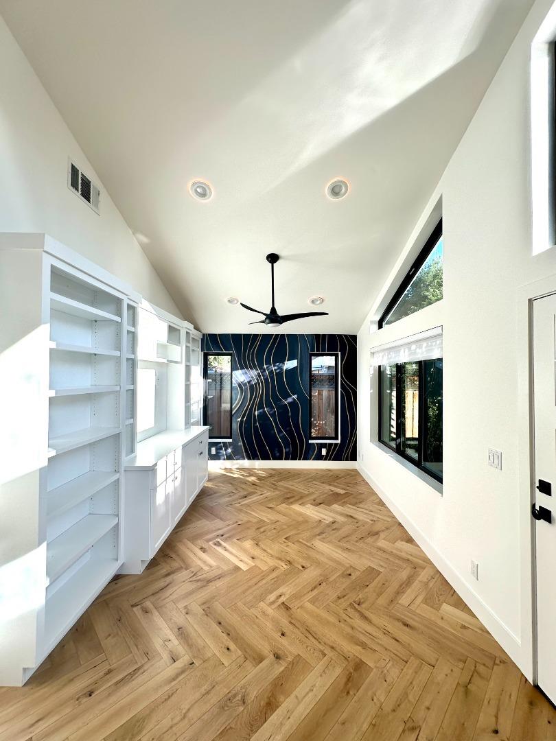 1092 Washington Street Mountain View, CA 94043 - Photo 9 of 32 a view of an empty room with a fireplace and a window