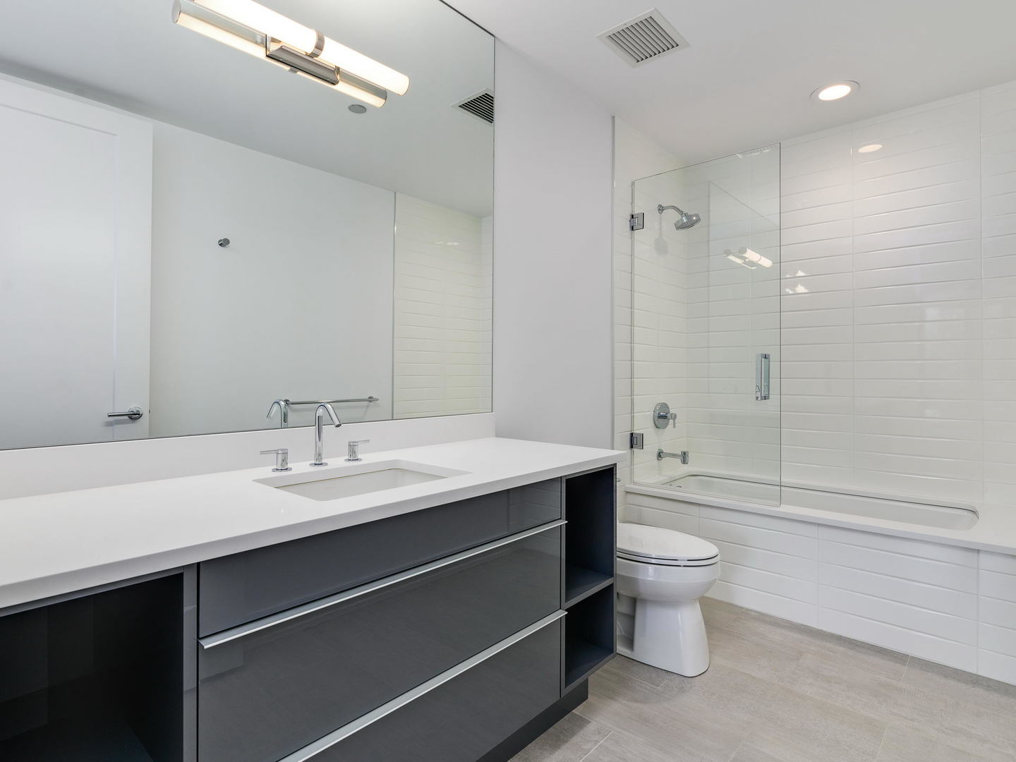 2 West Delaware Place, Unit 2802 Chicago, IL 60610 - Photo 12 of 22 a bathroom with a sink a toilet and shower