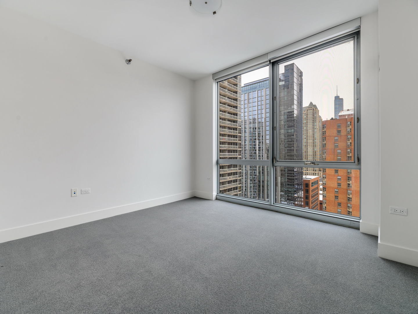 2 West Delaware Place, Unit 2802 Chicago, IL 60610 - Photo 13 of 22 a view of an empty room with a balcony