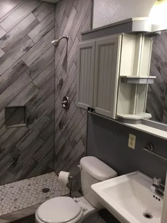 a bathroom with a sink and toilet