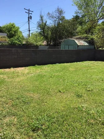 a view of yard with outdoor seating