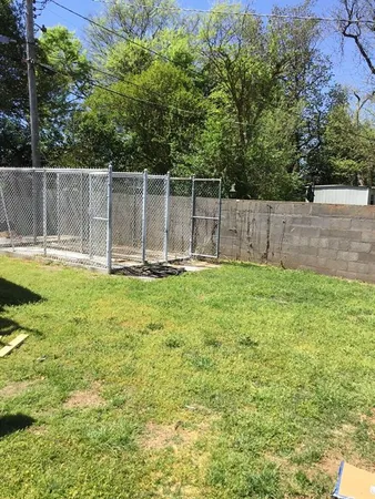 a swimming pool with wooden fence