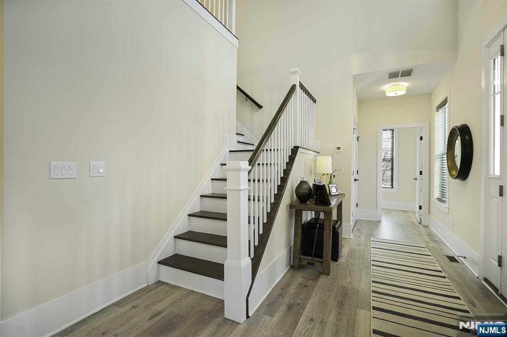 10 Aspen Drive Cedar Grove, NJ 07009 - Photo 14 of 43 a view of entryway with wooden floor and stairs