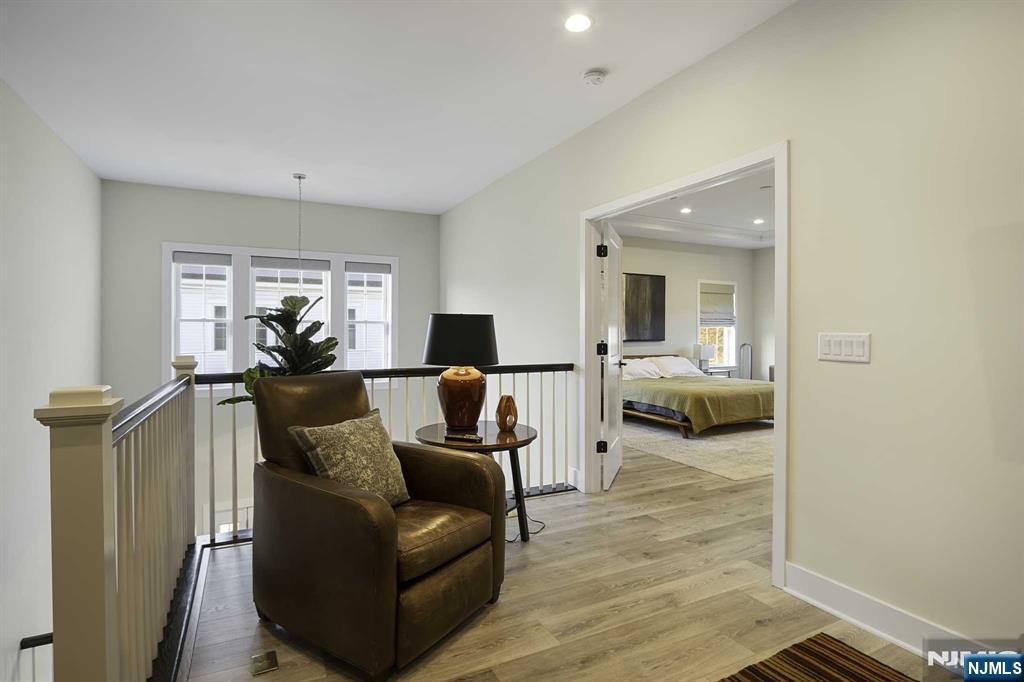 10 Aspen Drive Cedar Grove, NJ 07009 - Photo 17 of 43 a living room with furniture and a flat screen tv