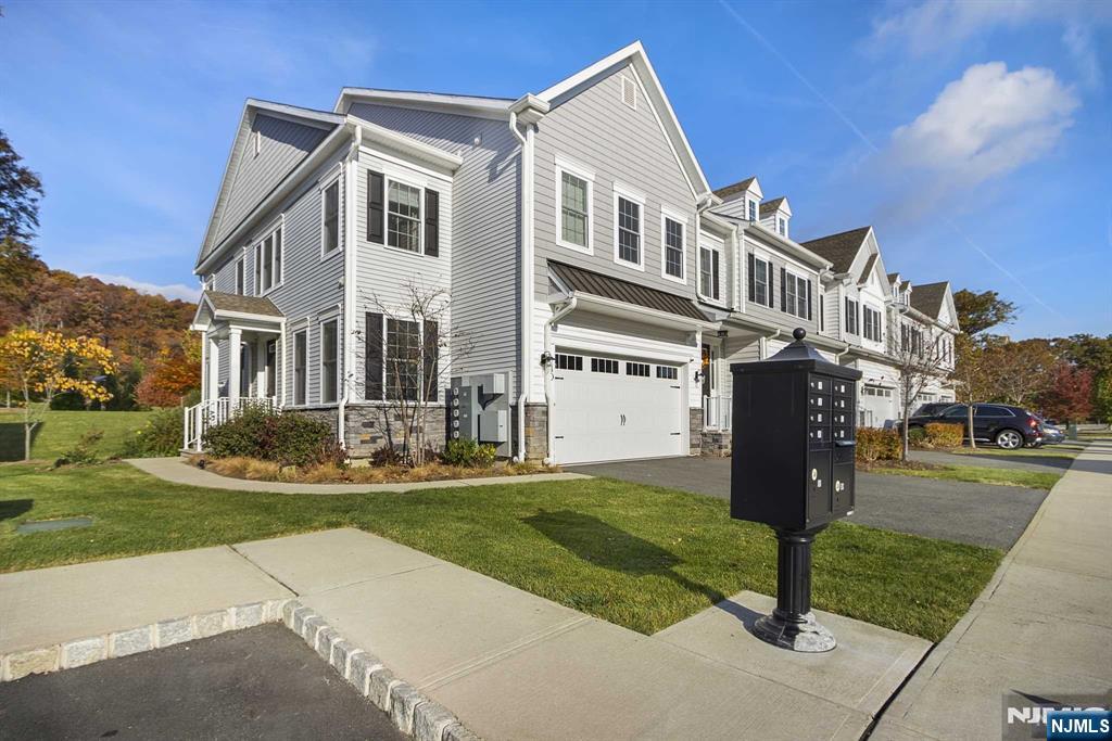 10 Aspen Drive Cedar Grove, NJ 07009 - Photo 2 of 43 a front view of a house with a yard