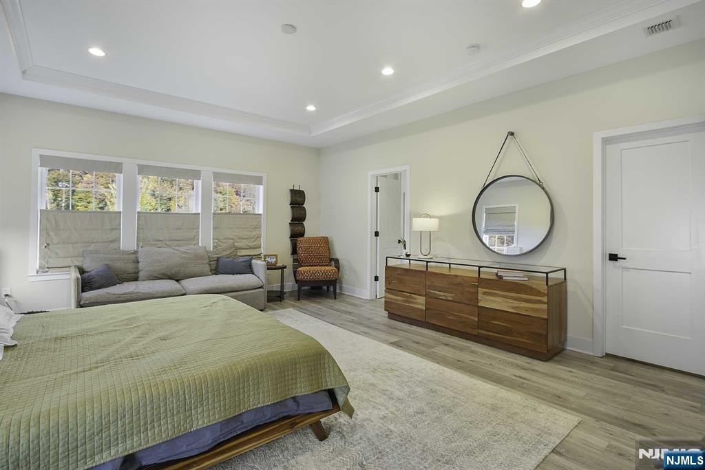 10 Aspen Drive Cedar Grove, NJ 07009 - Photo 22 of 43 a bedroom with furniture and a mirror