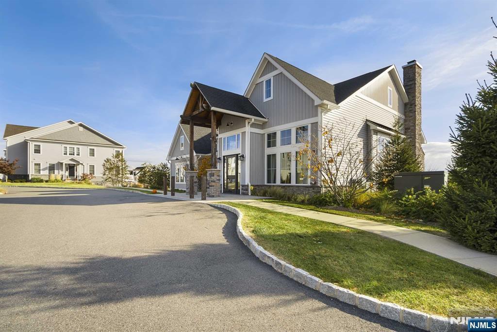 10 Aspen Drive Cedar Grove, NJ 07009 - Photo 29 of 43 a front view of a house with a yard