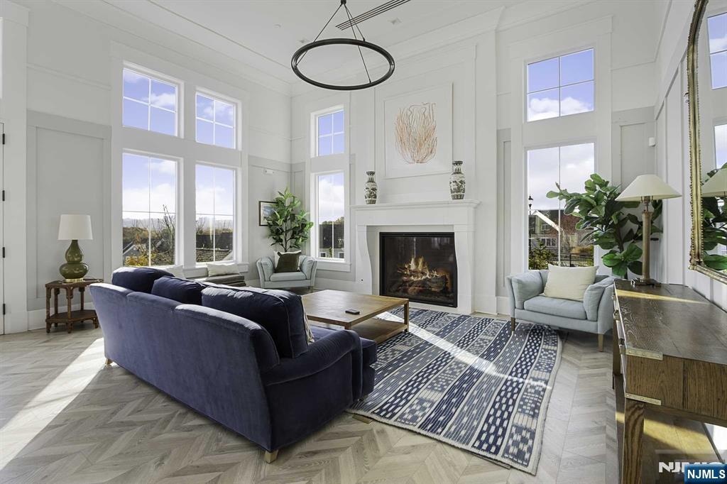 10 Aspen Drive Cedar Grove, NJ 07009 - Photo 32 of 43 a living room with furniture and a fireplace