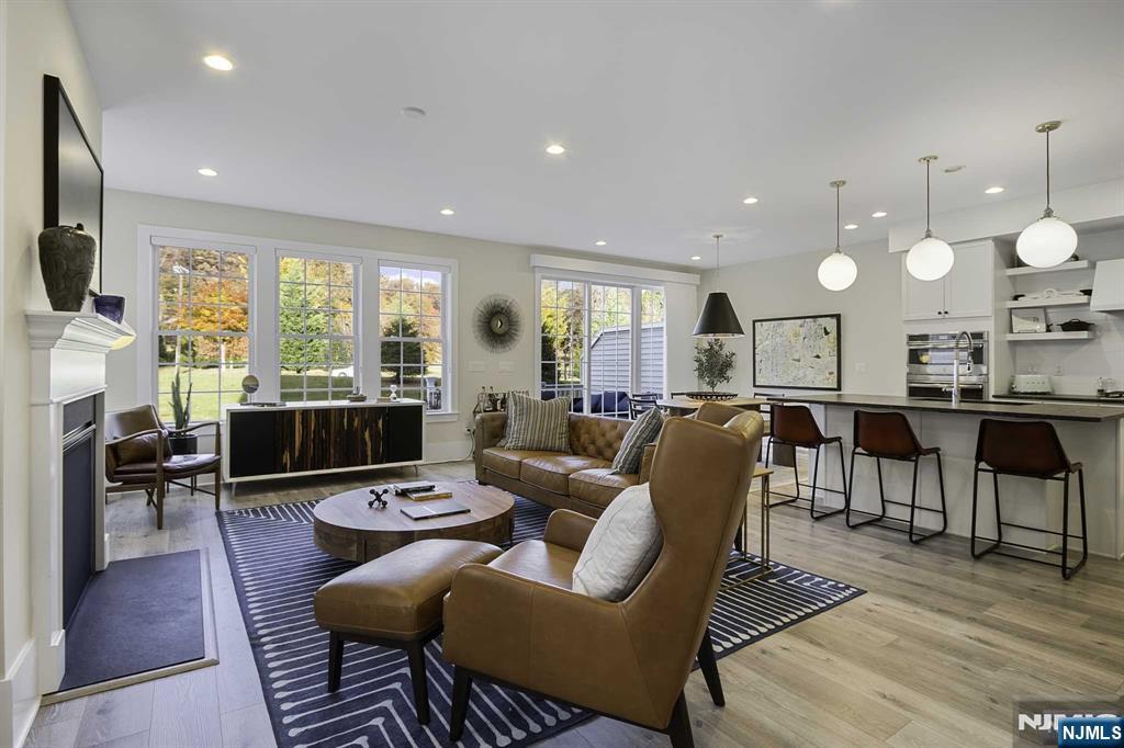 10 Aspen Drive Cedar Grove, NJ 07009 - Photo 5 of 43 a living room with lots of furniture and a flat screen tv