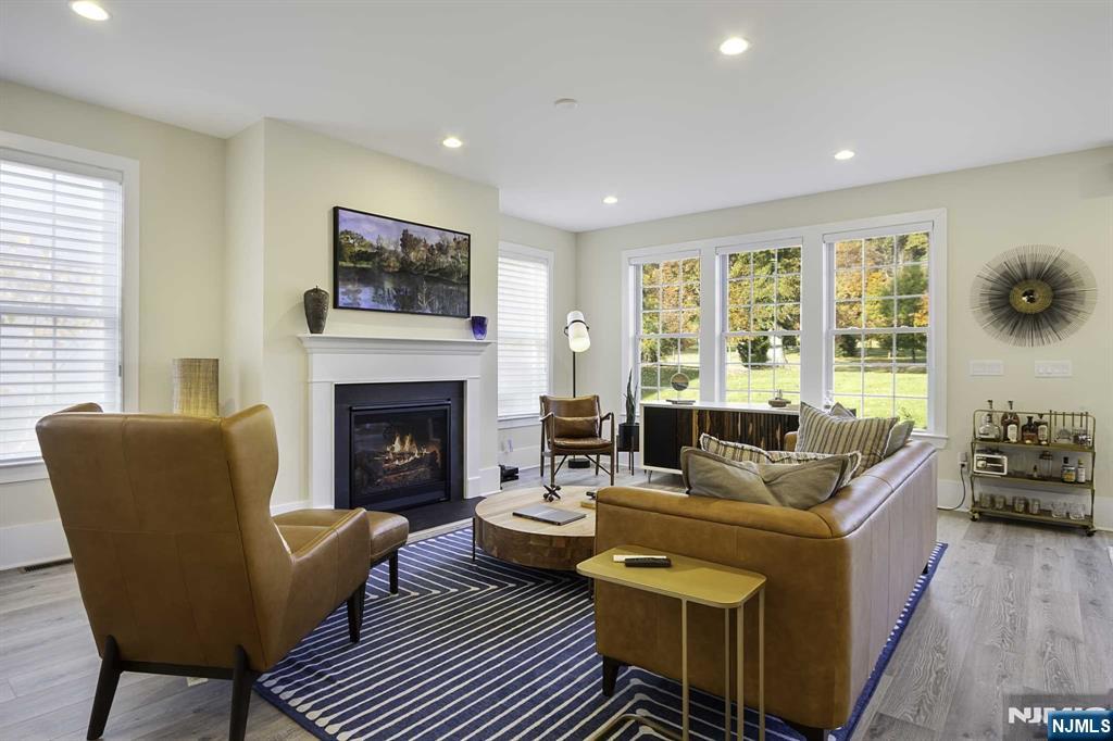 10 Aspen Drive Cedar Grove, NJ 07009 - Photo 6 of 43 a living room with furniture fireplace and window