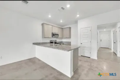 a bathroom with a sink a mirror and a shower