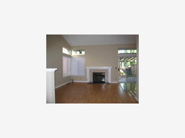 314 Moretti Lane Milpitas, CA 95035 - Photo 3 of 9 a picture of a living room with a fireplace