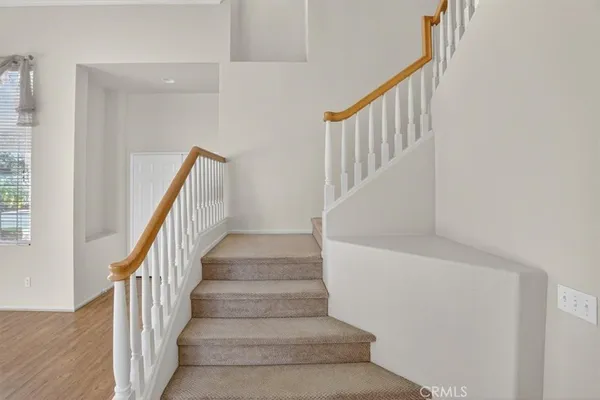 a view of an empty room with stairs