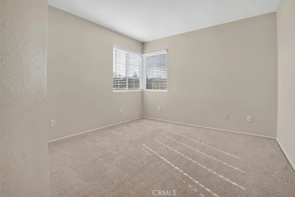a view of a hallway with closet area
