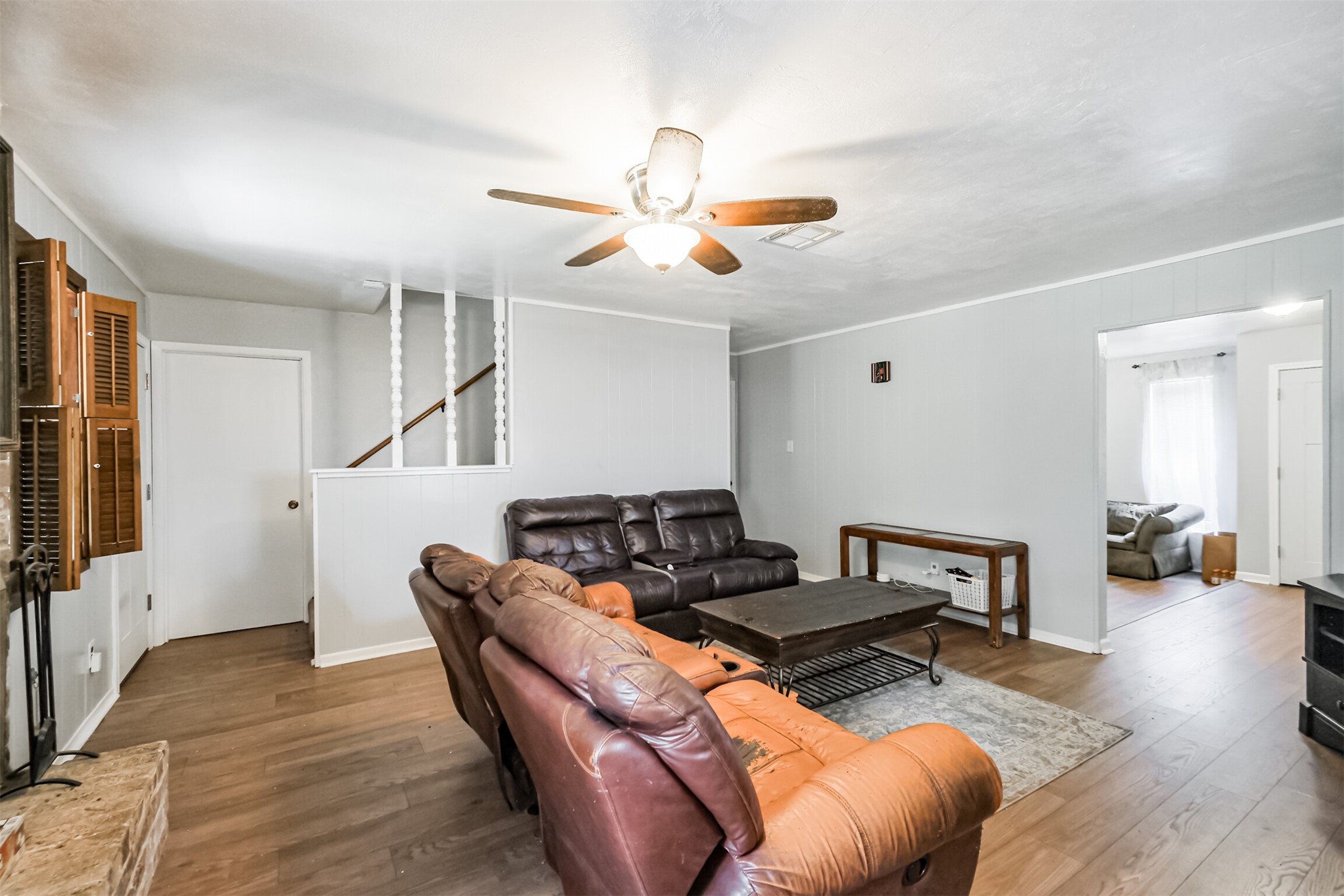 12207 Level Run Street Meadows Place, TX 77477 - Photo 16 of 44 a living room with furniture and wooden floor