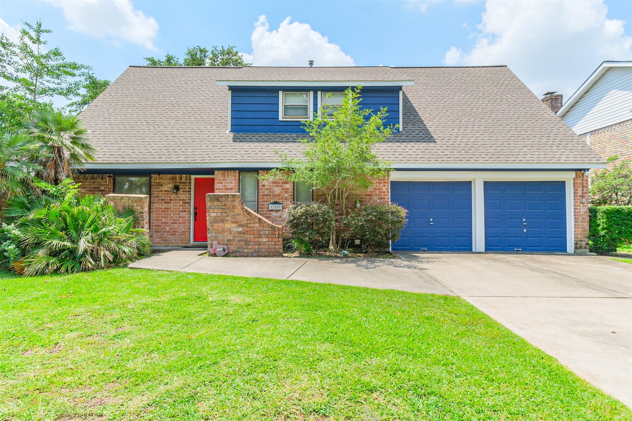 12207 Level Run Street Meadows Place, TX 77477 - Photo 2 of 44 a front view of house with yard and garage