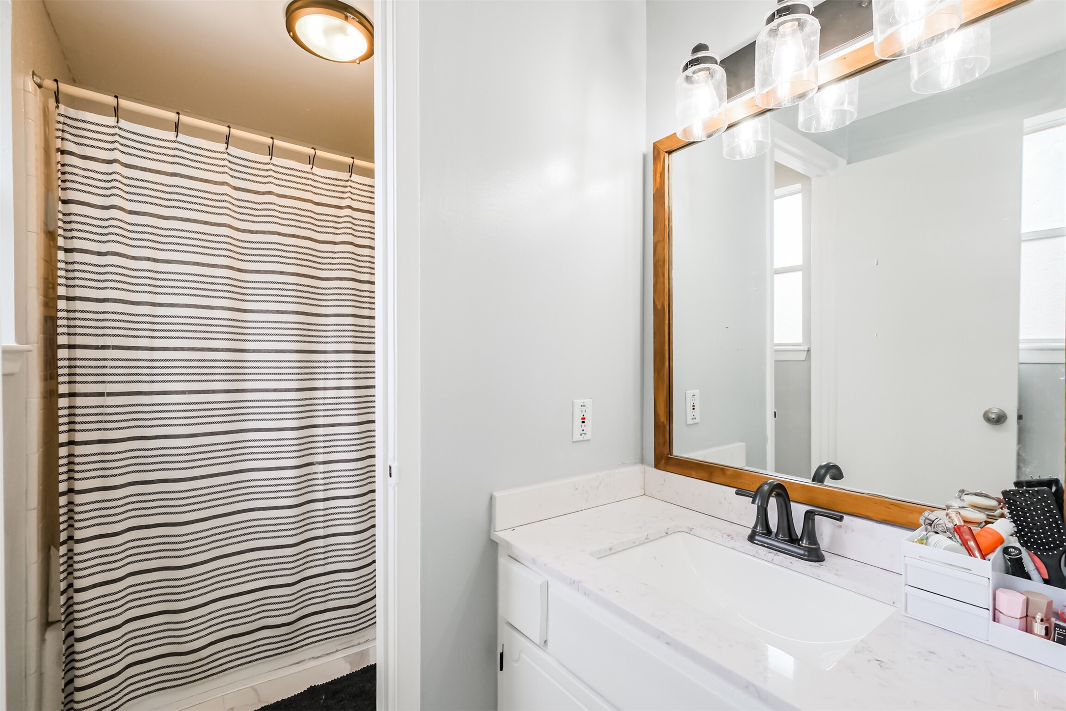 12207 Level Run Street Meadows Place, TX 77477 - Photo 23 of 44 a bathroom with a sink and a mirror