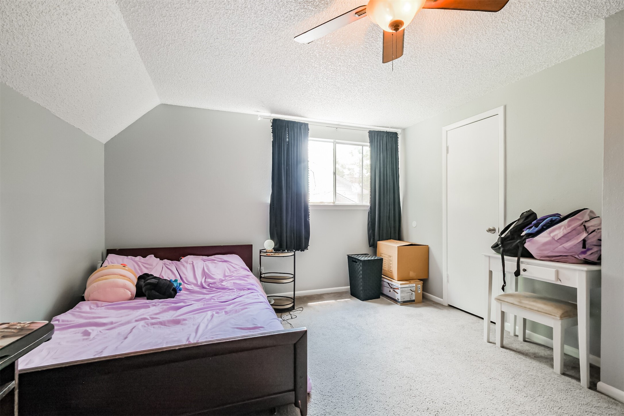 12207 Level Run Street Meadows Place, TX 77477 - Photo 29 of 44 a bedroom with a bed and dresser
