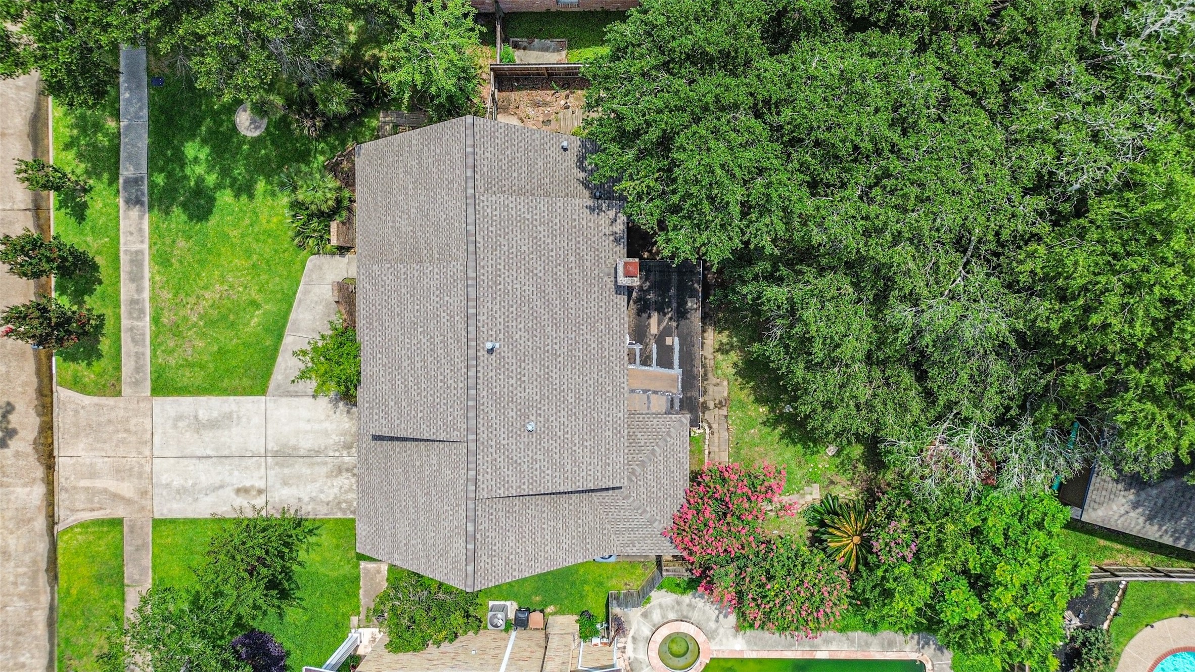 12207 Level Run Street Meadows Place, TX 77477 - Photo 37 of 44 an aerial view of a house with a yard and garden