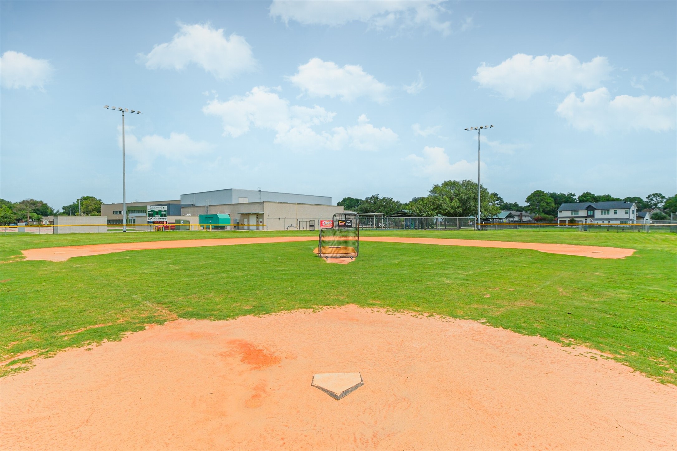 12207 Level Run Street Meadows Place, TX 77477 - Photo 43 of 44 a view of a golf course with a lake