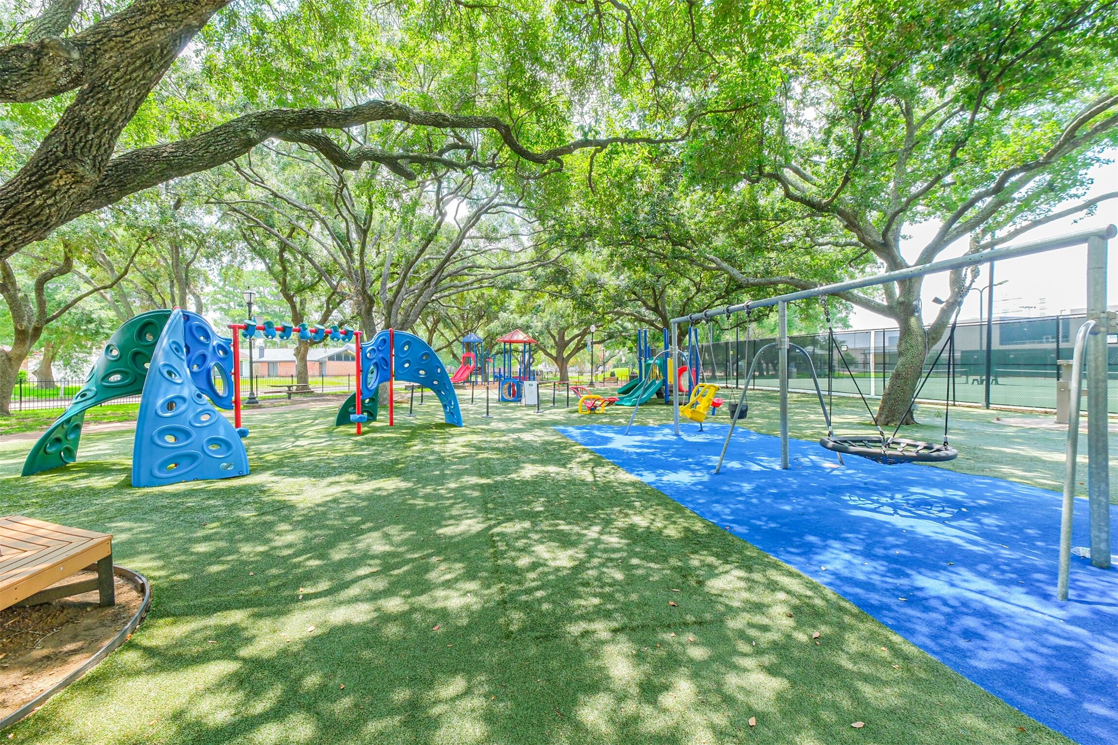 12207 Level Run Street Meadows Place, TX 77477 - Photo 44 of 44 a view of a park with swings and slides