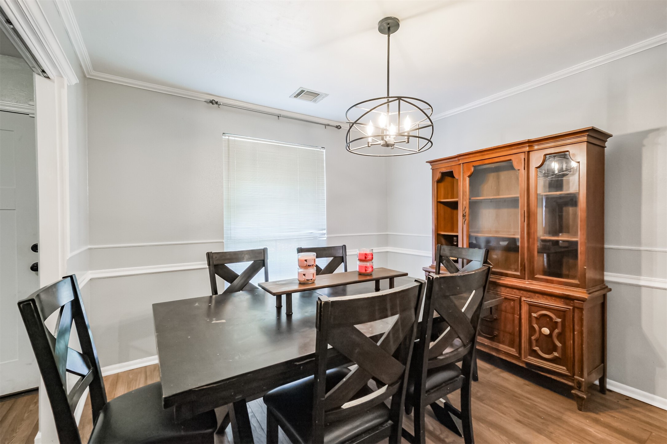 12207 Level Run Street Meadows Place, TX 77477 - Photo 7 of 44 a view of a dining room with furniture window and wooden floor