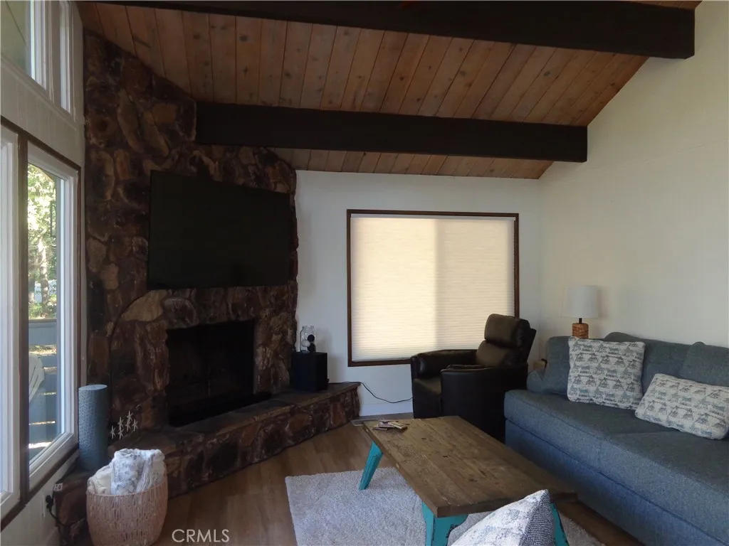 24273 Horst Drive Crestline, CA 92325 - Photo 23 of 34 a living room with furniture and a fireplace