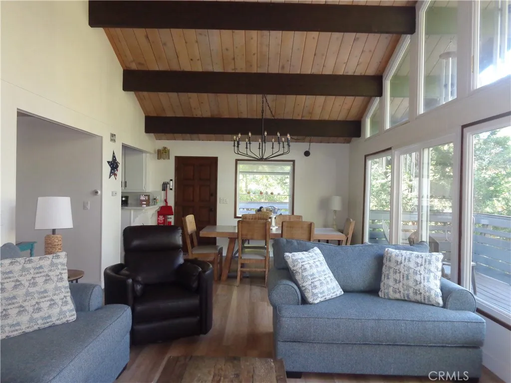 24273 Horst Drive Crestline, CA 92325 - Photo 24 of 34 a living room with furniture and a large window