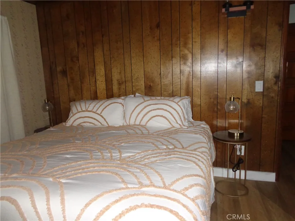 24273 Horst Drive Crestline, CA 92325 - Photo 5 of 34 a bedroom with a bed and a mirror